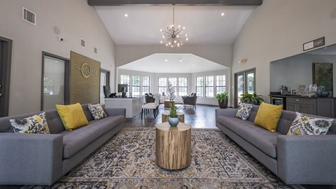 a living room with couches and a coffee table
